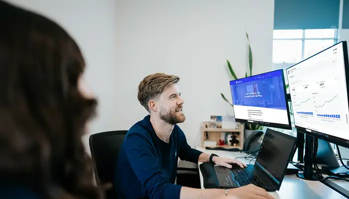 Member of staff working at a computer